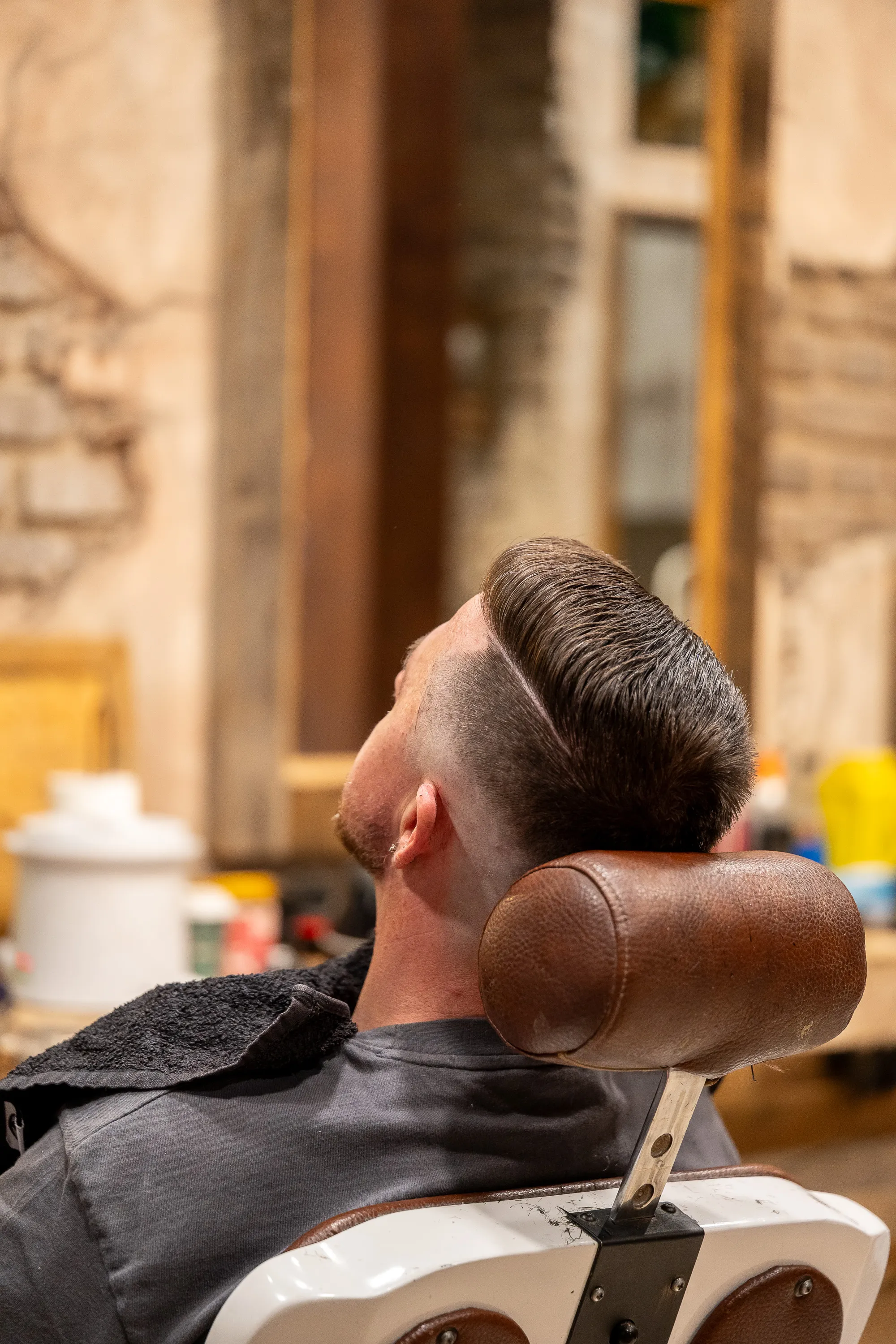 Fresh fade with a textured top, seen from the side