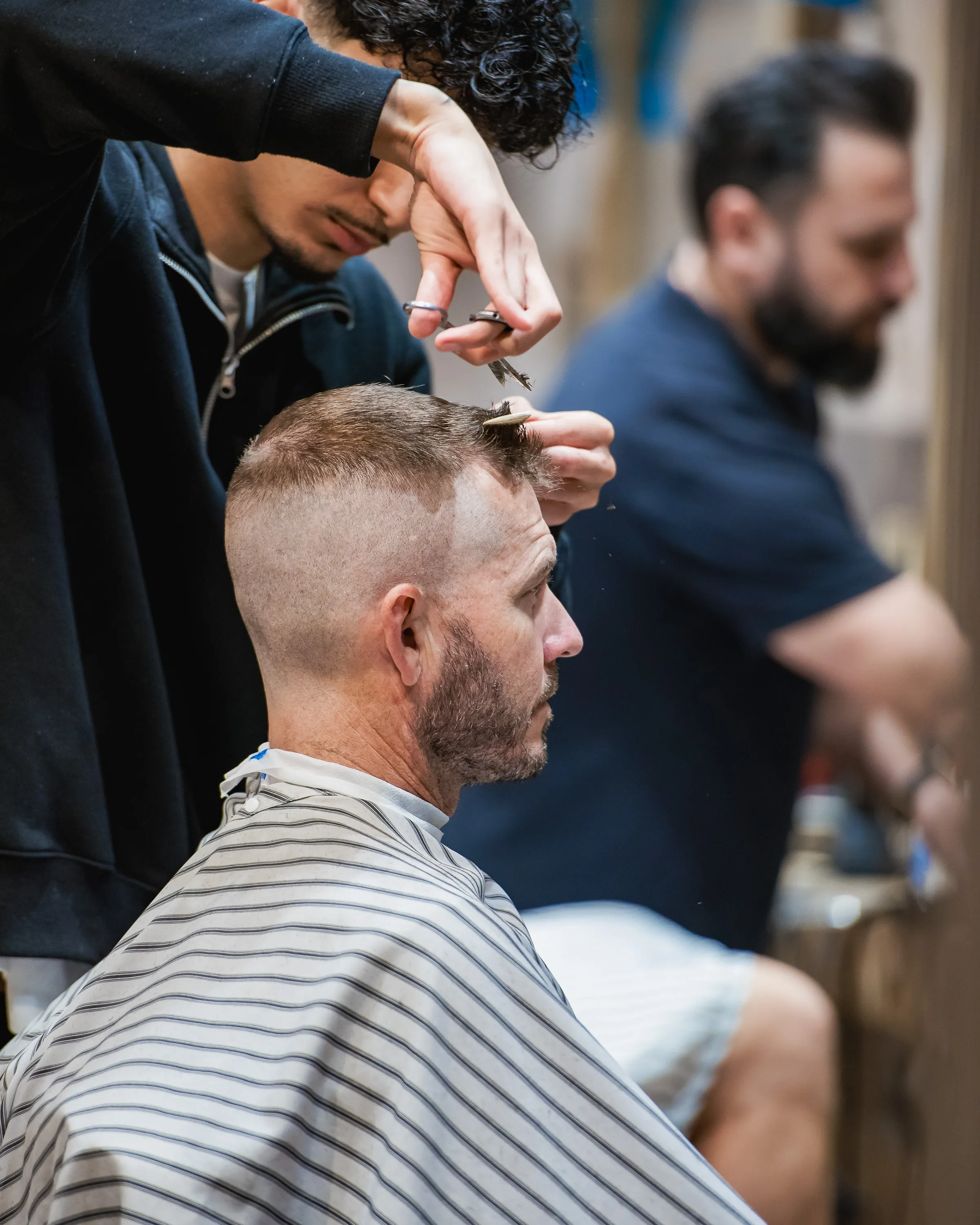 Scissor work on top for a short back and sides